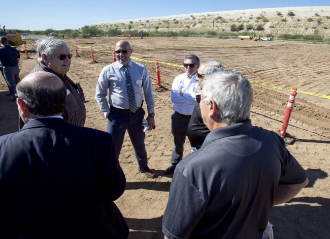 Sahuarita and Green Valley officials talk during the groundbreaking of the Sahuarita Advanced Manufacturing and Technology Center. The 32,000-square-foot building is expected to be completed next summer. Photo Rebecca Sasnett/Arizona Daily Star