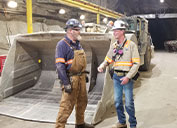 : Dave Loring, right, talks with Paul Goodman, Mobile Equipment Diagnostic Mechanic, during a recent walkthrough of the Henderson mine.