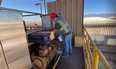 Emanuel Torres, a Reliability Engineering Intern at Safford, helps support the maintenance and performance of a hydraulic filter press.