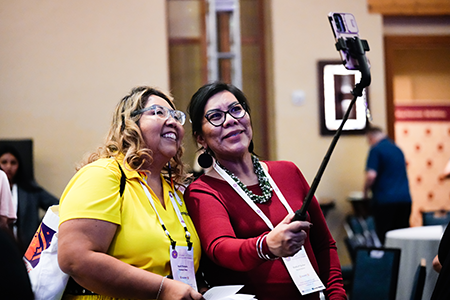 Project DreamCatcher graduates April Tinhorn (left) and Shalta (Shelley) Peshlakai Gerber take a break to capture the experience.