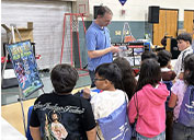 A banner welcomes the Freeport team for what academy leadership calls one of its favorite traditions; this year’s theme emphasized the important connection between energy, innovation and environmental responsibility; Theo Perkins and Alyssa Capriotti, both Environmental Scientist II, speak with some of the Ramona STEM Academy students about the importance of pollinators; with McGruff the Crime Dog on the scene, Freeport wasn’t the only familiar presence at the annual Earth Day celebration.